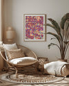 Cozy living room with wicker chair, decorative pillows, and a colorful abstract flower illustration painting.