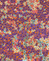 Colorful floral pattern with purple, orange, and blue flowers on a matching background